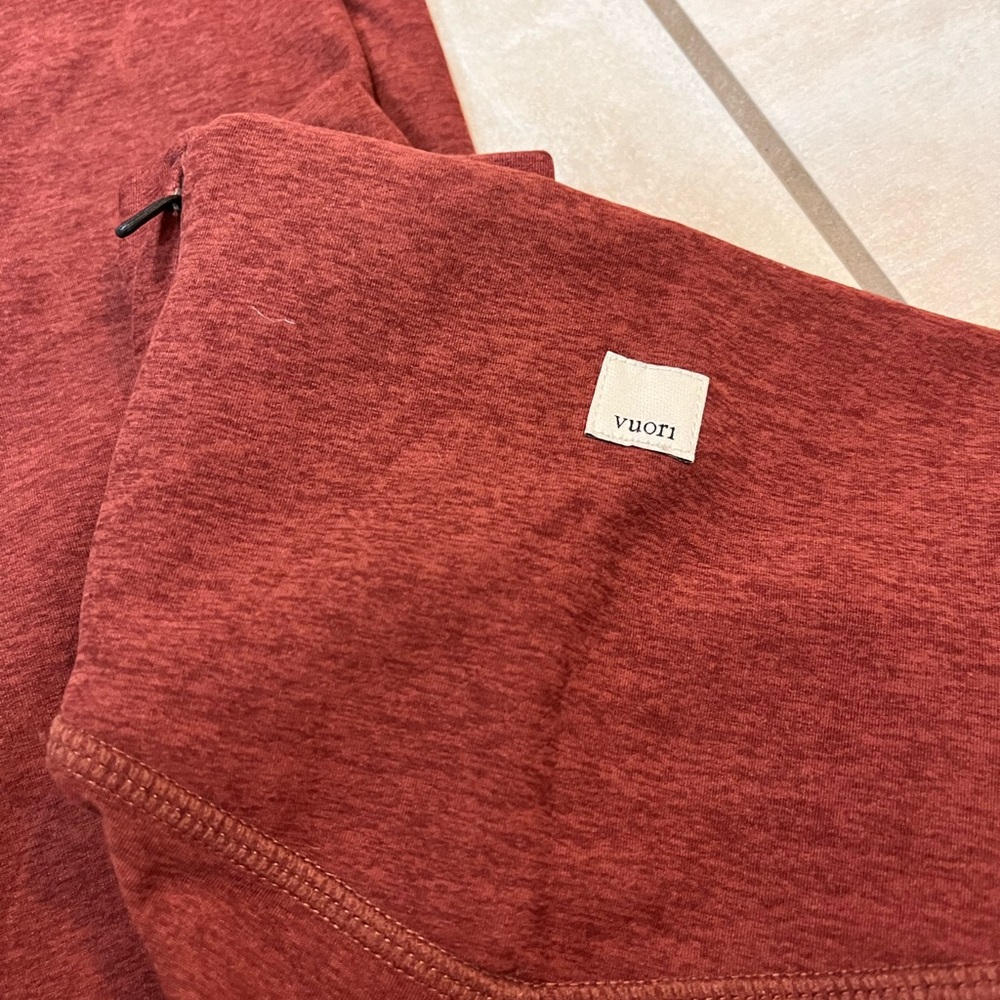 Vuori clean elevation legging, large, in discontinued brick red color.